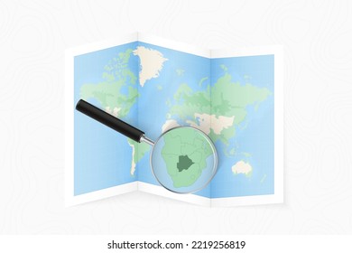 Enlarge Botswana with a magnifying glass on a folded map of the world. Vector paper map.