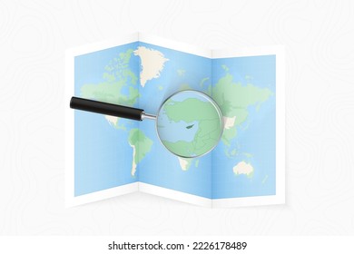 Enlarge Cyprus with a magnifying glass on a folded map of the world. Vector paper map.