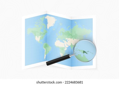 Enlarge Papua New Guinea with a magnifying glass on a folded map of the world. Vector paper map.