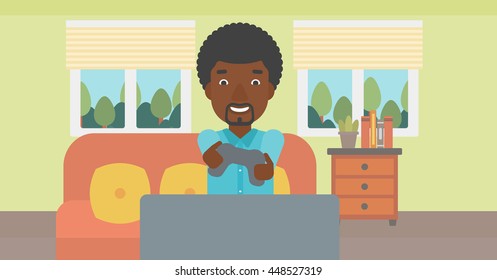An enthusiastic african-american man sitting on a sofa with gamepad in hands in living room vector flat design illustration. Horizontal layout.