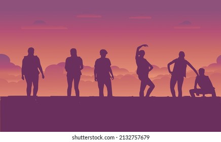Enthusiastic dance of young people gathered on the beach.