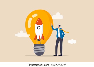 Entrepreneurship, setting up new business, motivation to create new business idea and make it success concept, businessman start up company owner standing with innovative rocket inside lightbulb idea.