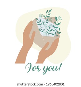 Envelope in hand. Inside a letter and botanicals of herbs and wildflowers. Romantic gift for a woman on any holiday.  A symbol with a message about the beginning of spring, summer and love. Vector