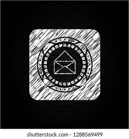 envelope icon drawn on a blackboard
