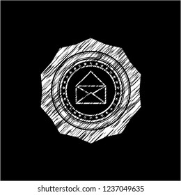 envelope icon drawn on a chalkboard