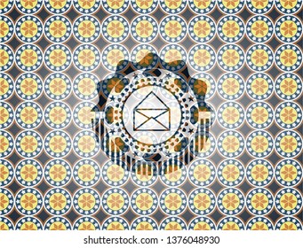 envelope icon inside arabic style badge. Arabesque decoration.