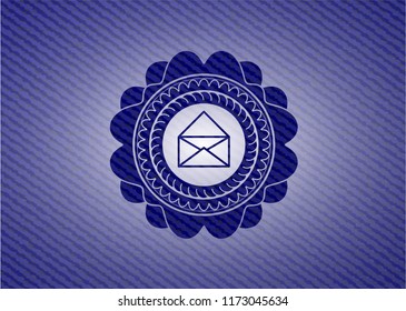 envelope icon inside badge with denim texture