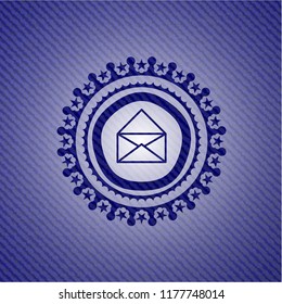 envelope icon inside badge with denim background