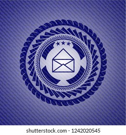 envelope icon inside badge with jean texture