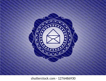 envelope icon inside badge with jean texture