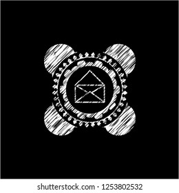 envelope icon inside chalkboard emblem on black board