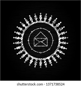 envelope icon inside chalkboard emblem written on a blackboard