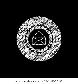 envelope icon inside chalkboard emblem written on a blackboard