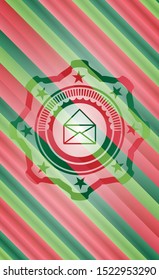 envelope icon inside christmas colors emblem.