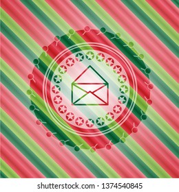 envelope icon inside christmas emblem.