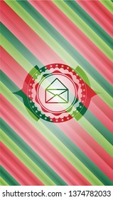 envelope icon inside christmas emblem.