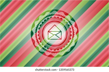 envelope icon inside christmas style emblem.