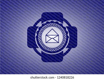 envelope icon inside denim background