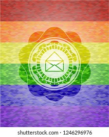 envelope icon inside emblem on mosaic background with the colors of the LGBT flag