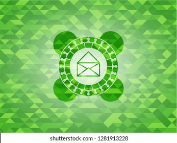 envelope icon inside green emblem with mosaic ecological style background