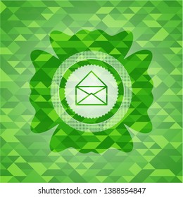 envelope icon inside green emblem with mosaic ecological style background