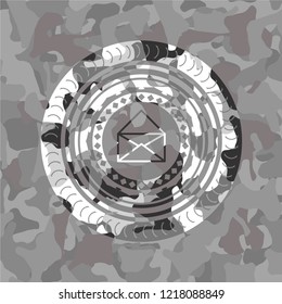 envelope icon inside grey camouflage emblem