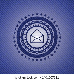 envelope icon inside jean or denim emblem or badge background
