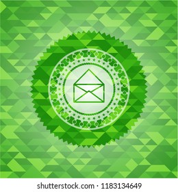 envelope icon inside realistic green emblem. Mosaic background