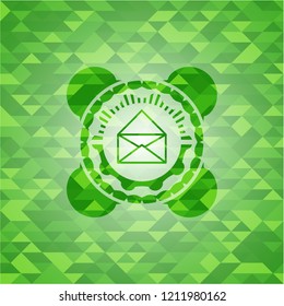 envelope icon inside realistic green mosaic emblem