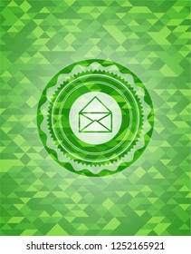 envelope icon inside realistic green mosaic emblem