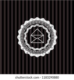 envelope icon inside silver emblem or badge