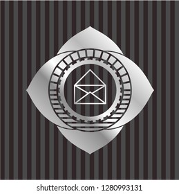 envelope icon inside silver emblem or badge