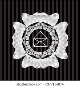 envelope icon inside silvery emblem or badge