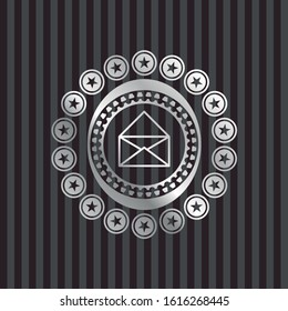 envelope icon inside silvery emblem or badge