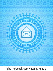 envelope icon inside water concept badge.