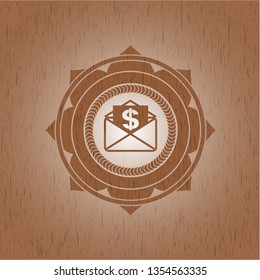 envelope with paper with money symbol inside icon inside wood badge or emblem