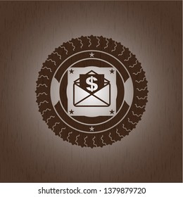 envelope with paper with money symbol inside icon inside retro wooden emblem