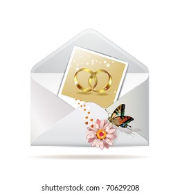 Envelope with photo of  two wedding ring, isolated on white background