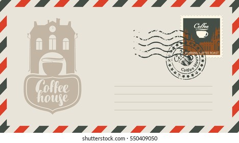 an envelope with a postage stamp for a coffee house with a vintage building and cups