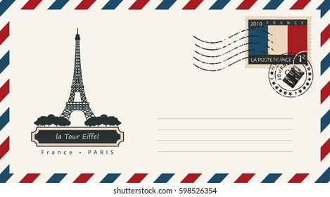 an envelope with a postage stamp with the Eiffel tower in Paris, and the flag of France
