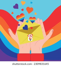 Envelope with rainbow hearts in hands
