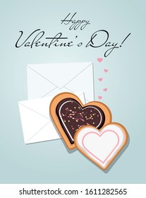 Envelopes and heart shaped cookies with glaze. Top view. Valentine's day.