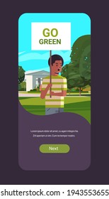 environmental activist holding poster go green save planet strike concept male protester campaigning to protect earth demonstrating against global warming portrait mobile app vertical copy space