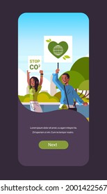 environmental activists holding poster go green save planet strike concept protesters campaigning to protect earth demonstrating against global warming portrait mobile app vertical copy space