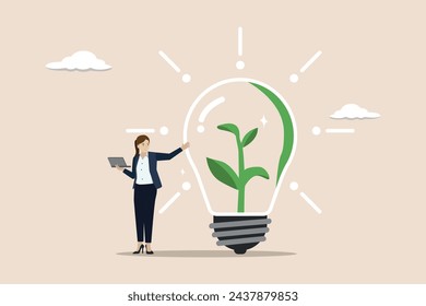 Environmental care in office, social responsibility strategy, ESG concept, businesswoman working with computer on green sustainable lightbulb.