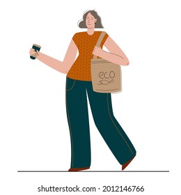 The environmentally friendly girl uses her reusable shopping bag and her reusable drink glass. Recycle and reuse things. Zero waste concept.