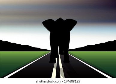 Eps 10 Editable vector silhouette of African elephant in walk pose on a road