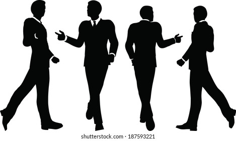 EPS 10 Vector illustration of business people walking with briefcase silhouette