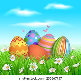 EPS 10 Vector illustration of colorful easter eggs in grass. Objects are layered. Used gradient mesh, blending modes and transparency. RGB color mode. Easy to edit.