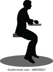 EPS 10 Vector illustration of silhouette of a business person in sitting pose